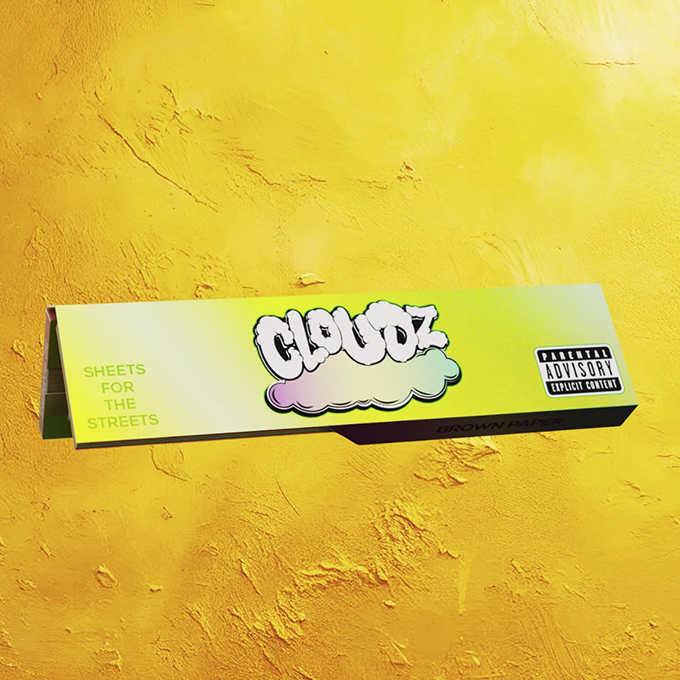 Neon lime box with graffiti-style cloud logo reading 'GLOOZ' or similar, text 'SHEETS FOR THE STREETS' on a bright yellow wall behind it.