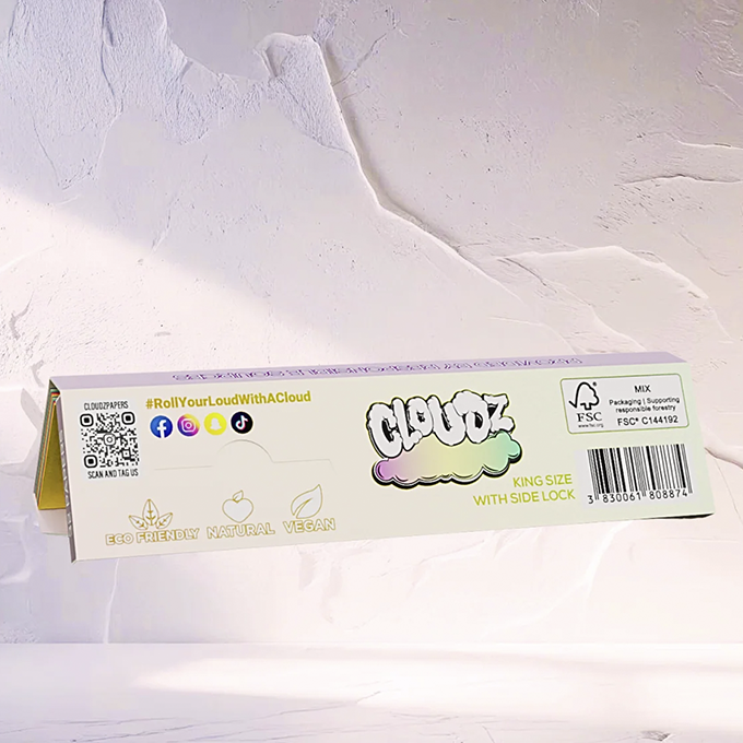 Cloudz-Rolling-Papers-White-2 - Volcano Premium Herbstones Cloudz product box with eco-friendly, natural, vegan icons floating against a pale purple textured background.