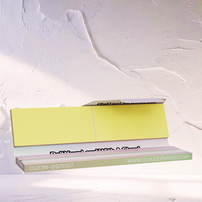 Cloudz-Rolling-Papers-White-3 - Volcano Premium Herbstones A yellow modular bench display in a white studio, with a mint green edge showing the website www.cloudzpapers.com and the phone number 01236-897007.