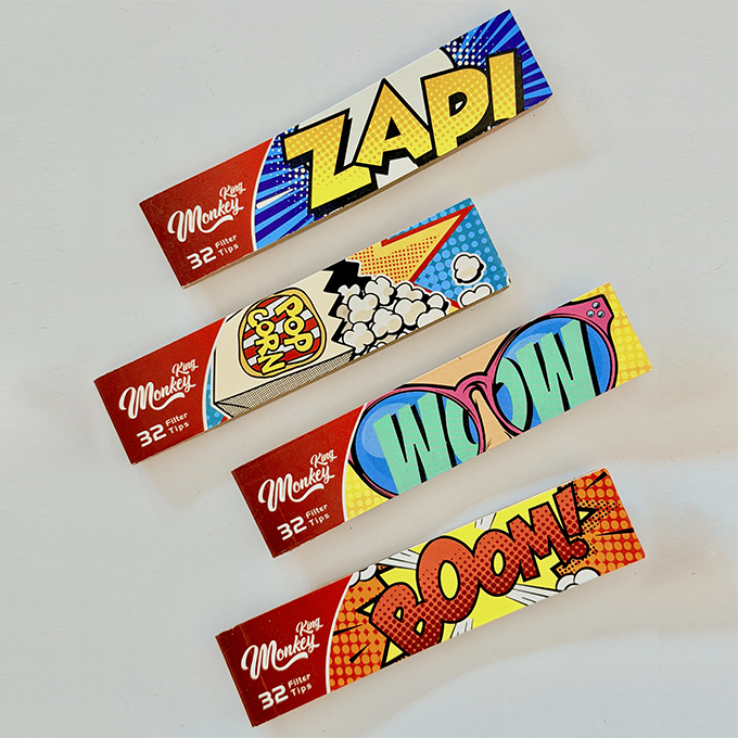 Four colorful comic‑style banners with bold words: ZAPI, POP, WOW, and BOOM; red ends show 'King Monkey'.�