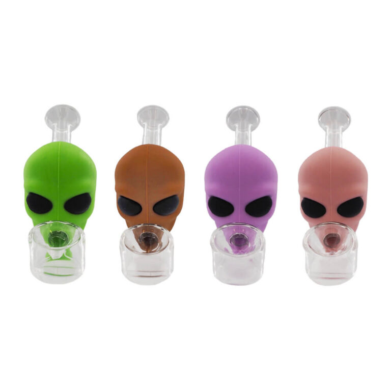 Four alien-shaped silicone smoking pipes in green, brown, purple, and pink, each with a clear glass bowl.